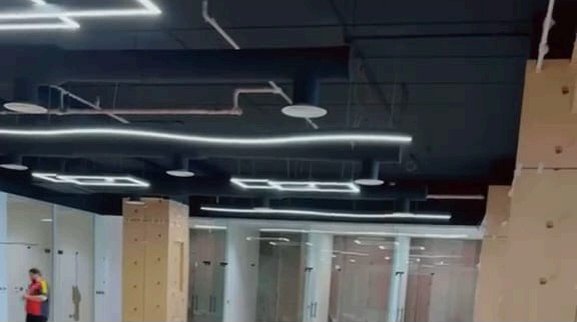 Open ceiling with suspended linear lighting